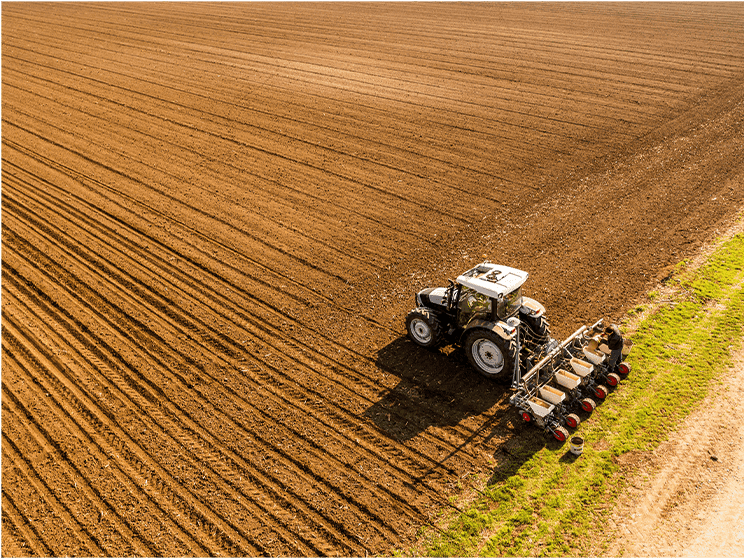 Tractor in open farmland